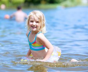 Little girl is happy in the water