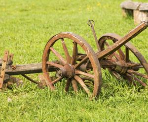 Old plough standing in the meadow