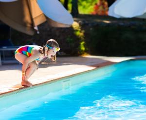 Little girl before jumping into the water