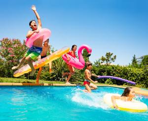 Children jump into the water